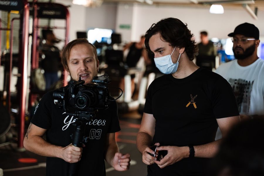 Lachlan on set during the Pandemic with a mask on